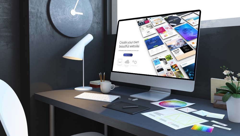Modern website design workspace with desktop computer showing website layout