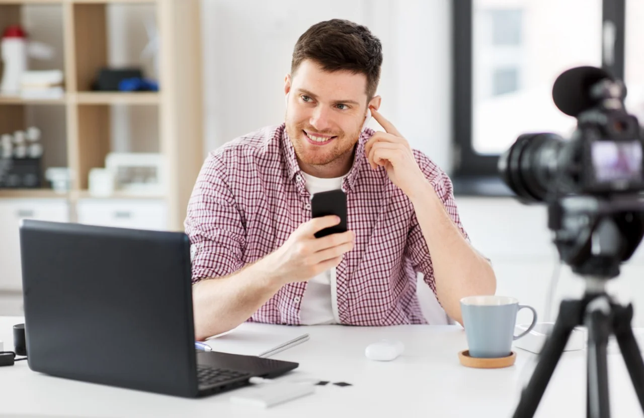 Content creator recording video marketing content at desk
